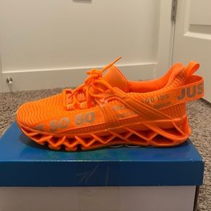 Just So So orange running shoe. Europe size 39 is a size 8.5 U.S.